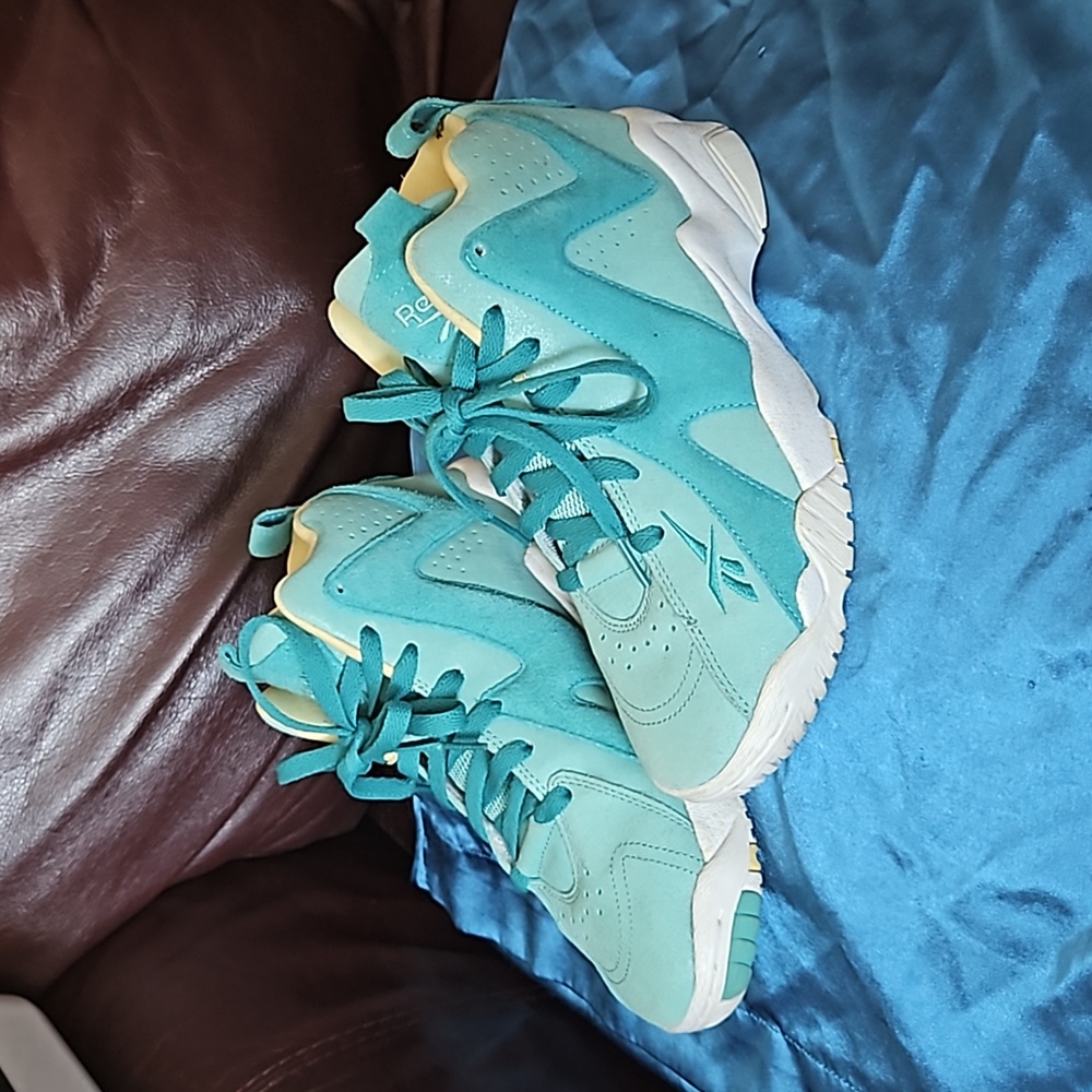 Teal and yellow Reebok basketball sneakers